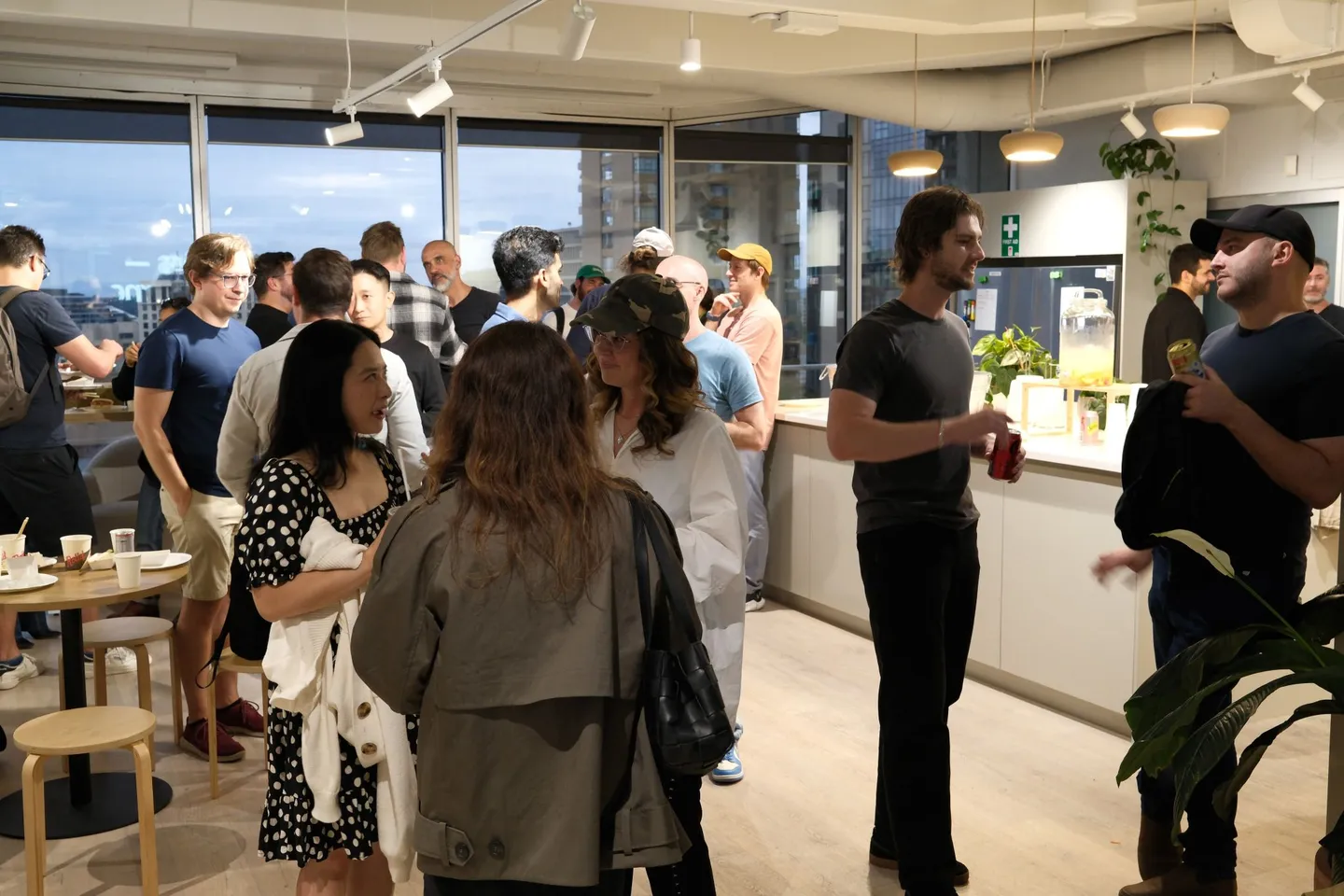 Groups of guests networking together at an AI Ops meetup