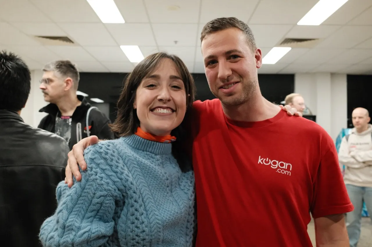 Two happy guests smiling for a photo at an AI Ops meetup